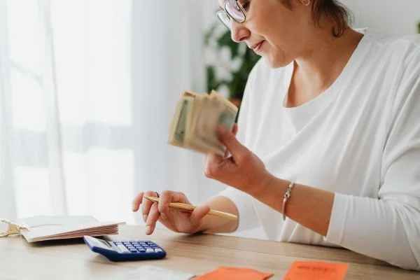 Woman reviewing remodeling budget at home