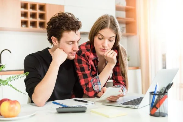 Couple reviewing priorities for home remodeling